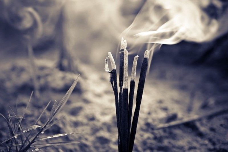 burning incense black and white